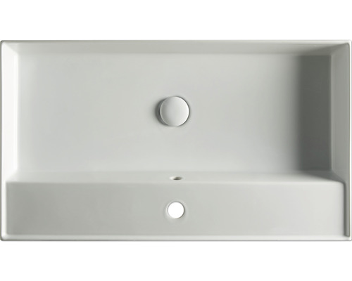 Pohled shora na obdélníkové keramické umyvadlo se zátkou