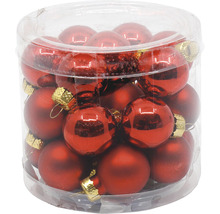 Průhledná skleněná nádoba s červenými vánočními koulemi