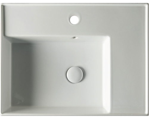 Pohled shora na obdélníkové keramické umyvadlo s přepadem