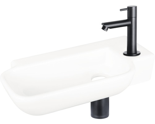 Bílé umyvadlo na desku s černou baterií