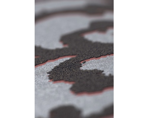 Detailní pohled na povrch s nepravidelným vzorem z malých kuliček