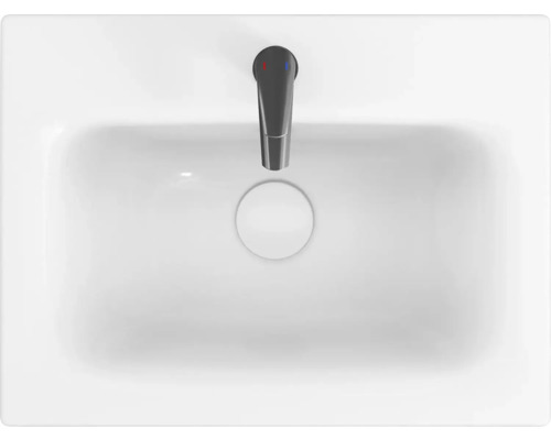 Bílé umyvadlo na desku s baterií shora