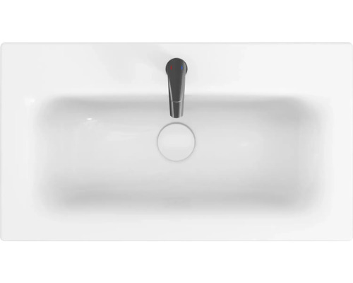 Bílé umyvadlo s baterií shora