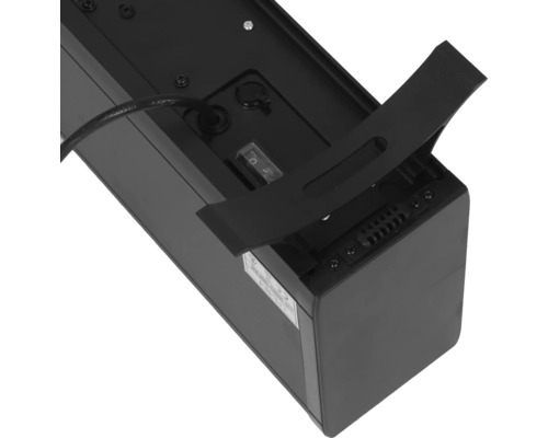 Zadní strana černého elektronického zařízení s kabelem, spínačem a držákem