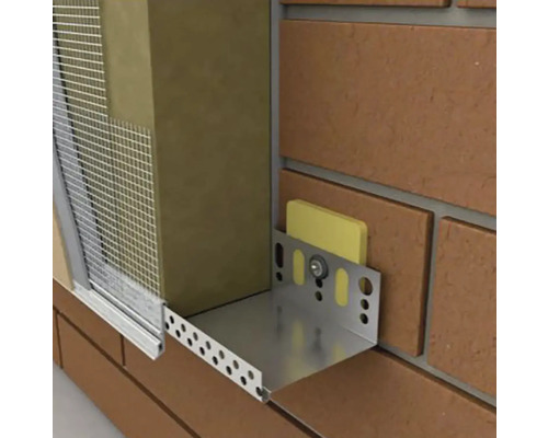 Detailní pohled na izolaci fasády s izolačním materiálem, armovací tkaninou a montážním profilem.