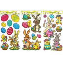 Dekorativní okenní obrázky s velikonočními motivy, jako jsou zajíčci a velikonoční vajíčka