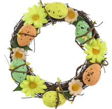 Dekorativní velikonoční věnec s vejci a květinami pro velikonoční dekoraci