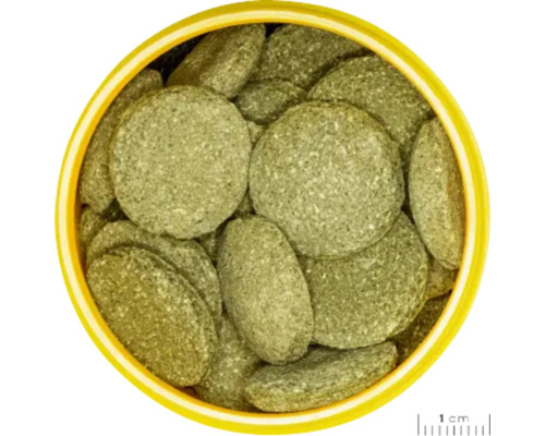 Krmné tablety pro ryby v žluté nádobě