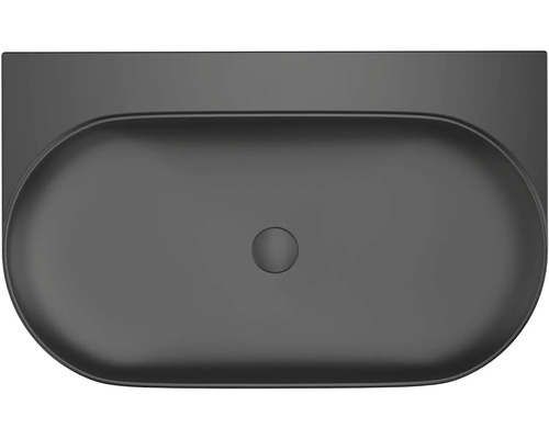 Pohled shora na oválné keramické umyvadlo na desku