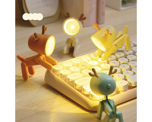 Dekorativní LED stolní lampičky ve tvaru psa na klávesnici