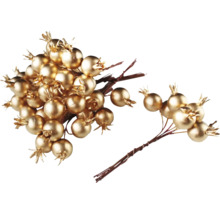 Dekorativní zlaté bobule na větvích