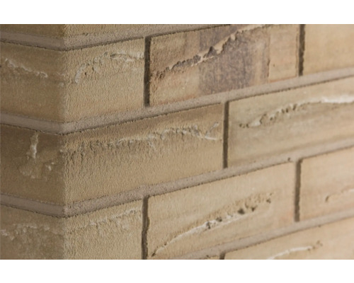 Obkladový kámen rohový barvy podzimu 24x7,1 cm Elastolith Detailní záběr cihlové zdi.