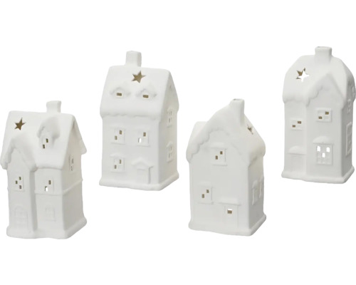 Čtyři bílé keramické domky jako držáky na čajové svíčky