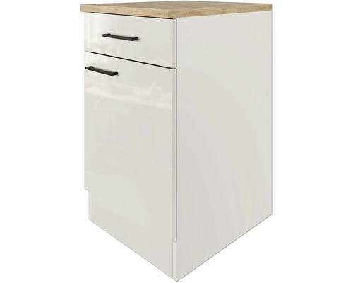 Bílá spodní skříňka se zásuvkami a pracovní deskou