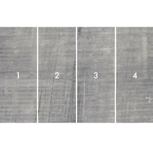 Detailní záběr čtyř betonových desek s různými povrchovými strukturami