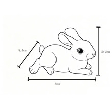 Kresba ležícího králíka s rozměry: délka 16 centimetrů, výška 10,2 centimetrů a šířka 8,4 centimetrů.