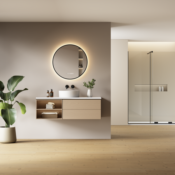 Moderní koupelna s koupelnovou skříňkou, kulatým zrcadlem s LED osvětlením, umyvadlem na desku a sprchovým koutem v minimalistickém stylu.