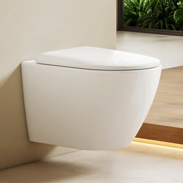 Závěsné keramické WC v moderní koupelně s dřevěnými prvky a rostlinami.