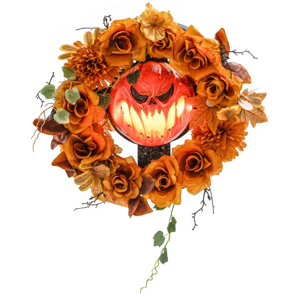 Halloweenská dekorace s dýňovou tváří a květinovým věncem