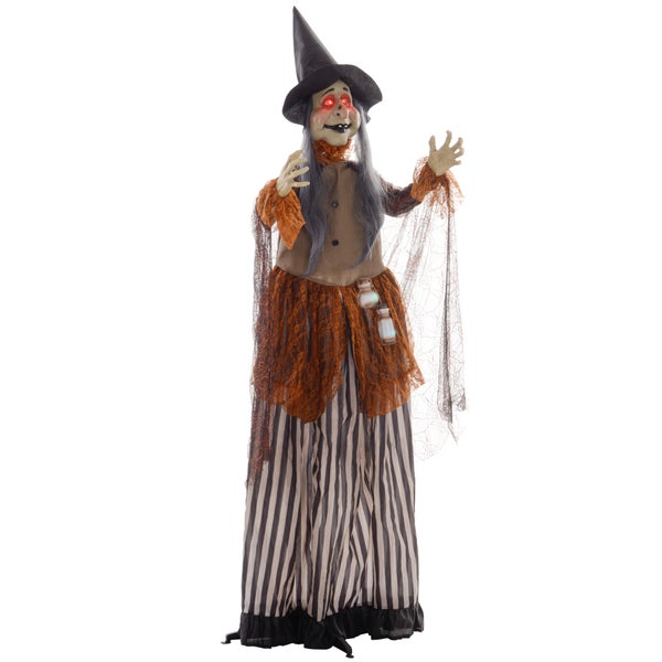 Dekorativní halloweenská čarodějnice s kloboukem, rouchem a svítícíma očima jako strašidelná dekorace