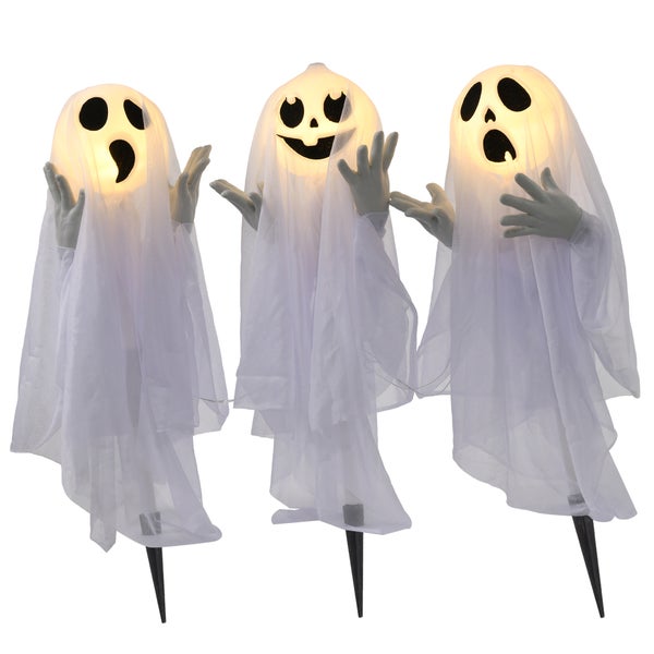 Tři duchové jako halloweenská dekorace s osvětlením a bílou látkou