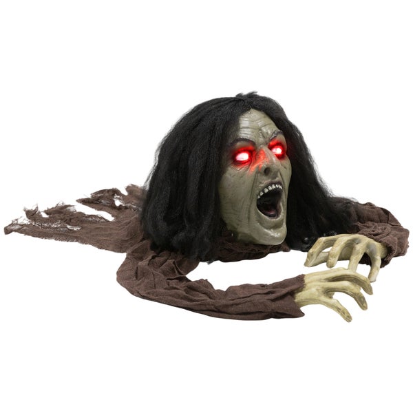 Lezoucí zombie jako halloweenská dekorace se svítícíma očima