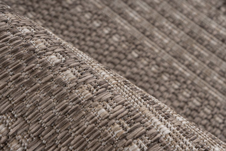 Detail tkané textury koberce s hrubou strukturou