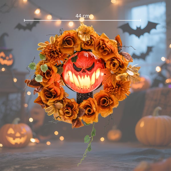 Halloweenský věnec na dveře s dekorací dýňové tváře o průměru 44 cm.