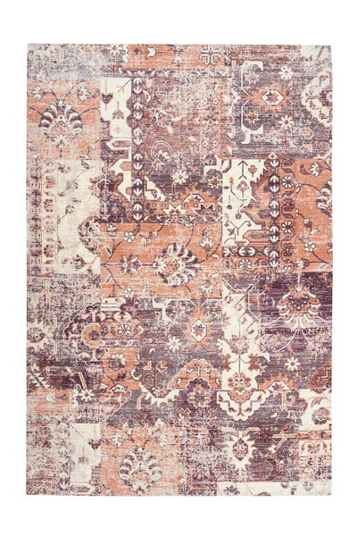 Vintage koberec s patchwork designem a orientálními vzory s vybledlým vzhledem.