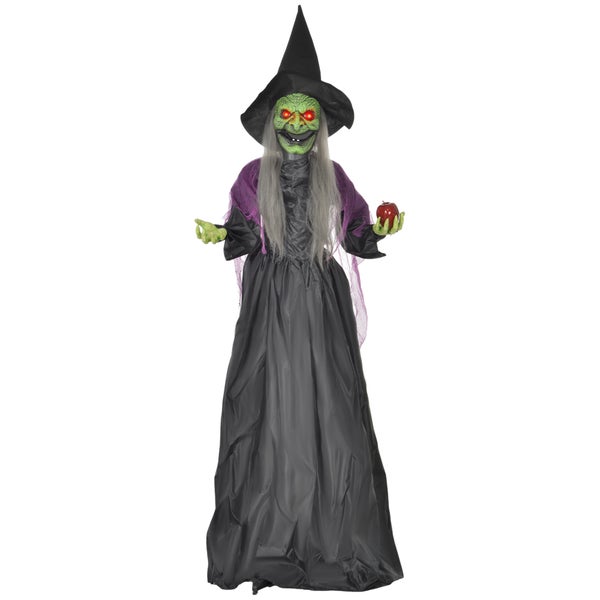 Dekorativní halloweenská čarodějnice s jablkem, stojící.