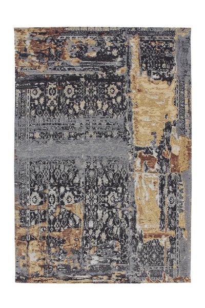 Obdélníkový koberec s abstraktním patchworkovým designem a orientálními vzory ve vintage vzhledu.